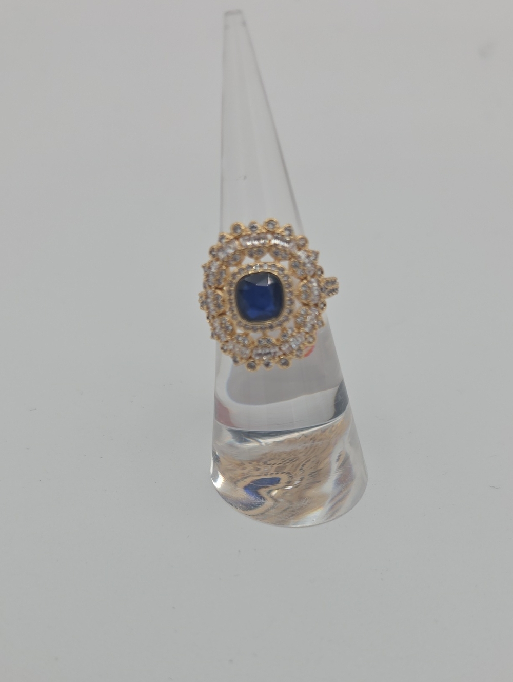 Gold Plating Ring with Blue Centerstone and Halo of Clear Stones